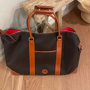 Dooney & Bourke Cabriolet travel bag.  New never used.